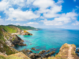 Spain Galicia coast near northernmost point of Spain rugged cliffs diving into turquoise Cantabrian...