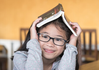 World book day, educational literacy, reading eye vision care concept with funny face Asian school...