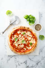 Traditional pepperoni pizza with fresh basil