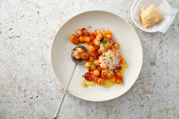 Potato gnocchi with tomato and cheese