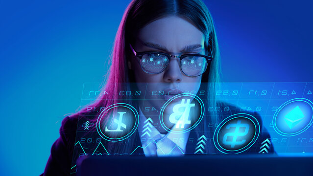 Focused professional analyzes cryptocurrency data on a digital interface in a futuristic setting. Concept of digital finance innovation, empowerment via financial technologies