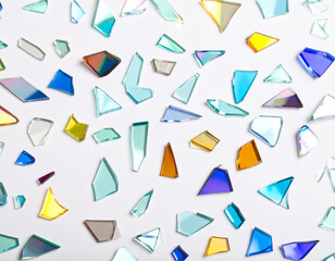 Closeup photo of colorful glass shards, on white background
