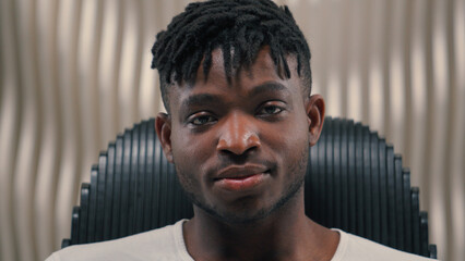 Close up portrait African American ethnic man male guy serious mood unsmiling confident emotion...