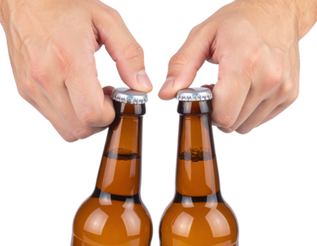 Two hands opening capped brown beer bottles against a black background.