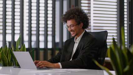 African American ethnic man business male using laptop typing online professional creative guy...