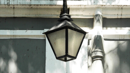 Closeup of a vintage lantern installed on an old building