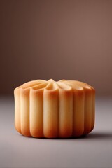 An elegant shot of a golden mooncake, perfect for celebrating the Mid-Autumn Festival.