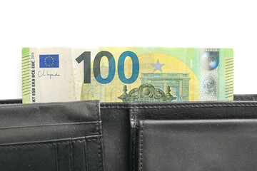 One hundred euro banknote in black leather wallet. Close-up of paper currency in pocket. European money cash. Financial concept. Savings and budget planning. Personal finance and economic background