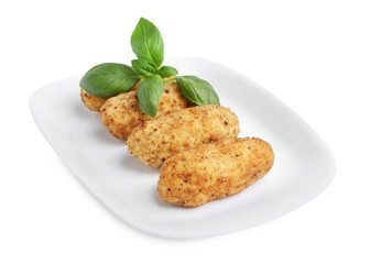 Tasty fried croquettes and basil isolated on white