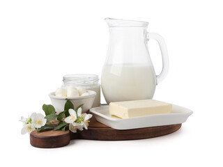 Different fresh dairy products and flowers isolated on white