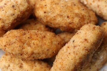 Tasty fried croquettes as background, closeup view