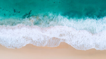 Aerial view of ocean waves crashing on sandy beach, tropical summer seascape perfect