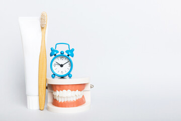 Mouthwash and other oral hygiene products on colored table top view with copy space. Flat lay....