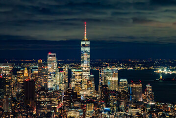 Fototapeta premium Night View from the Empire State Building: One World Trade Center and Illuminated Harbor