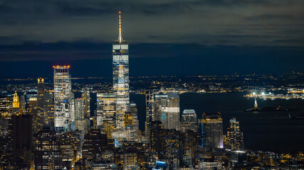 Naklejka premium Night View from the Empire State Building: One World Trade Center and Illuminated Harbor
