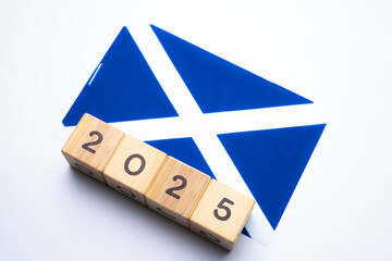 2025, Scotland flag with date block, Concept, Important events for Scotland the new year, election, economy, social activities, central bank, Scotland foreign policy