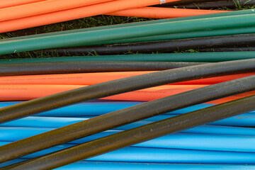Industrial cables ready for installation. Close-up of fiber optic infrastructure.