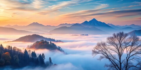 Serene Dawn Misty Mountains and a Leafless Tree in the Golden Hour