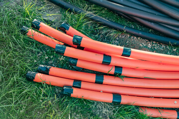 Telecom and Power Tubes for Building Site. Industrial-grade pipe layout.