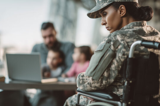 Female veteran in wheelchair contemplates family life, showcasing military service and the importance of family bonds.