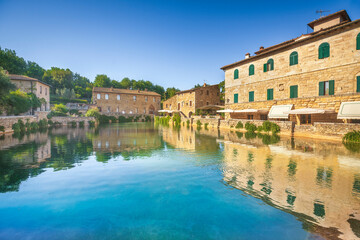 Obraz premium Bagno Vignoni village and thermal baths or hot pool. Tuscany, Italy.