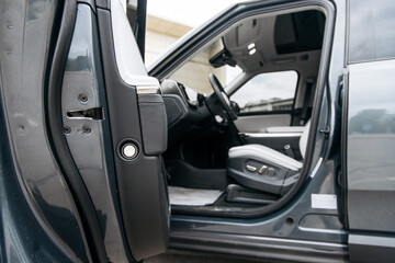 Close-up of new modern car outdoors. Concept of renting or buying new car and modern design.