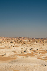 White rock formations and sand dunes in Egypt's White Desert, natural desert landscape	