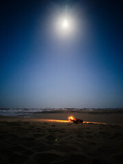 Campfire in the night camp in the White Desert in Egypt. Fire under the sky
