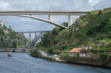The Infante Dom Henrique bridge spanning the Douro river in Porto.  Built in 2003 it spans 280 arch.