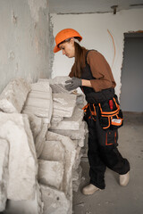 labor construction worker building and taking stone tiles to build indoors
