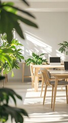 Sunlight streams through the windows of a modern office space filled with lush greenery, featuring wooden tables and minimalist design that inspires productivity and calmness.