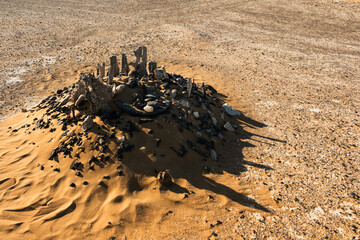 Ash-covered hills in Egypt's Black Desert under a clear sky, scenic and remote landscape. Volcanic	