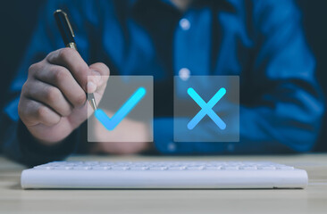 Businessman thinking and deciding between right and wrong symbols. Voting decision. Yes or no...