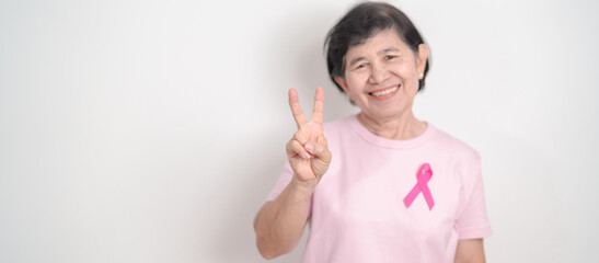 Elderly woman with pink Ribbon for Pink October Breast Cancer Awareness month, May Women Health,...