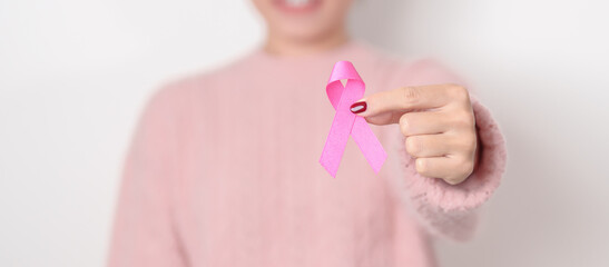 Pink October Breast Cancer Awareness month concept, woman with pink Ribbon for May Women Health,...