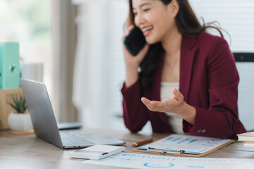 Focused Communication: A cheerful individual engages in a dynamic phone call, complemented by a...