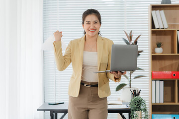 Triumph in the Workplace: Confident professional celebrates a major milestone in a modern office...