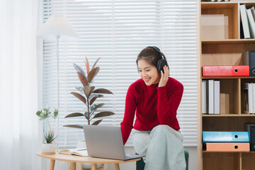 Serene Study Session: A young individual, immersed in an online learning session, basks in the glow...