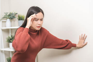 Dizzy asian young woman, girl headache or migraine pain. suffering from vertigo, difficulty...