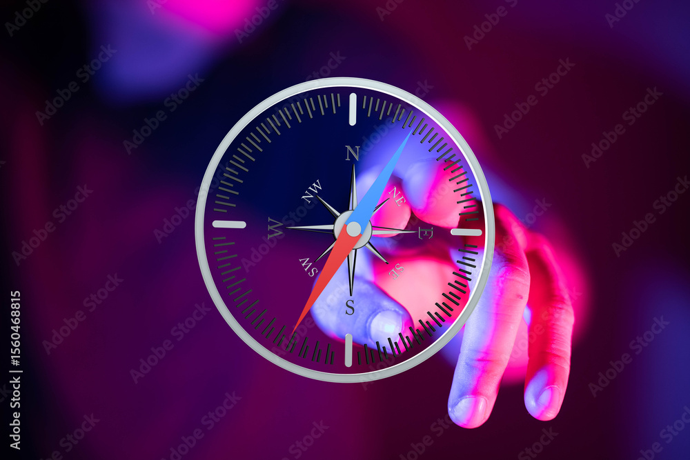 Poster abstract image of a hand using a digital compass, symbolizing direction and guidance.