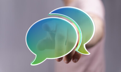 Abstract image of two speech bubbles, representing communication, conversation, and dialogue.
