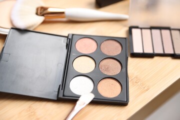 Different makeup products on wooden vanity, closeup
