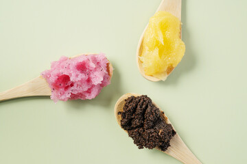Mango, strawberry and coffee sugar scrub showcasing smooth texture, ideal for beauty and skincare product presentations. Variety of exfoliating scrubber. Facial and body care peeling scrub.