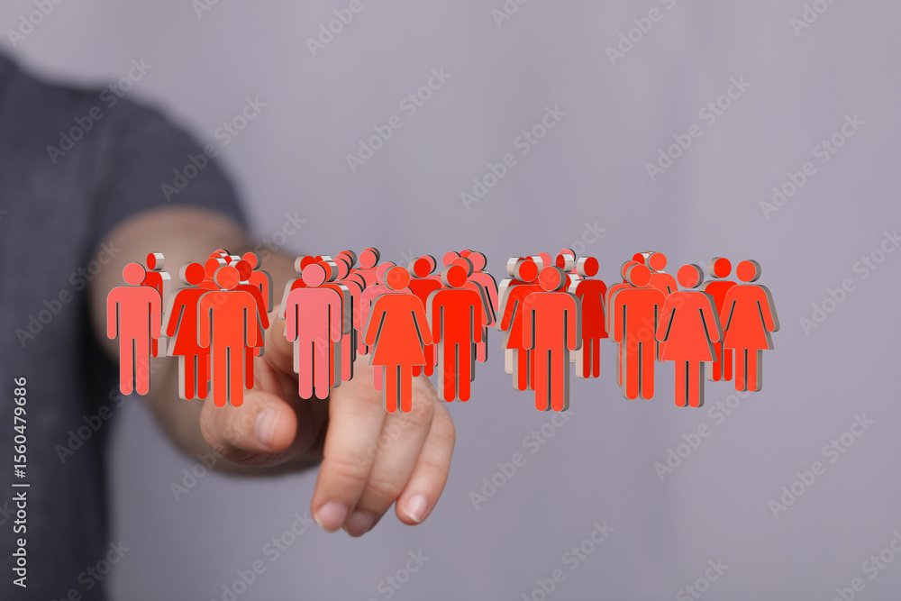 Aufkleber hand interacting with a digital representation of a diverse group of people. ideal for teamwork, com