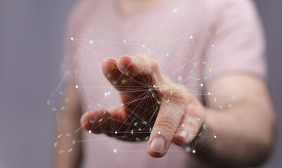Person's hand interacting with a digital network, showcasing connectivity and technology.