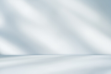 Empty white and soft blue shadow light overlay wall Room interiors studio concrete backdrop and floor cement shelf, well editing montage display products and text present on free space grey background