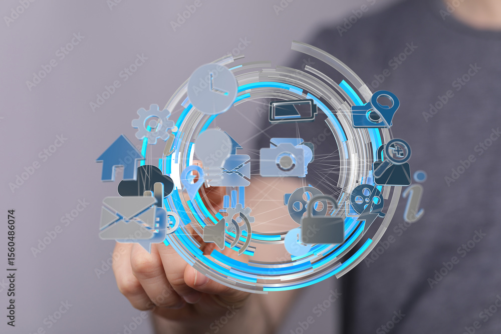 Poster hand interacting with a digital network of icons representing modern technology and communication.