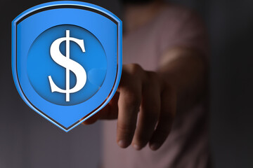 Hand pointing at a digital dollar sign inside a shield.  Financial security, digital assets, online...