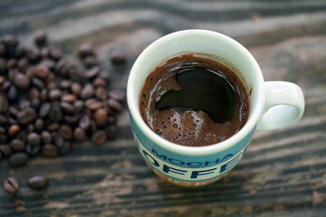 cup of coffee with beans