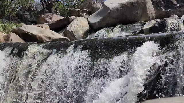 Freshwater River Between Rocks and Trees